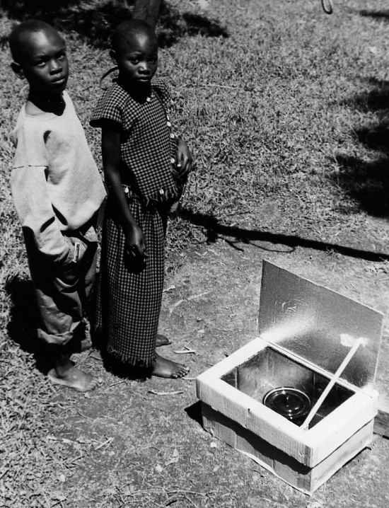 African kids with a box cooker